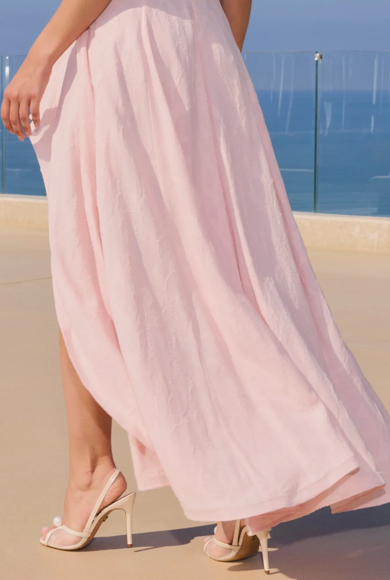 Elmina – light pink midi dress with an asymmetrical hem