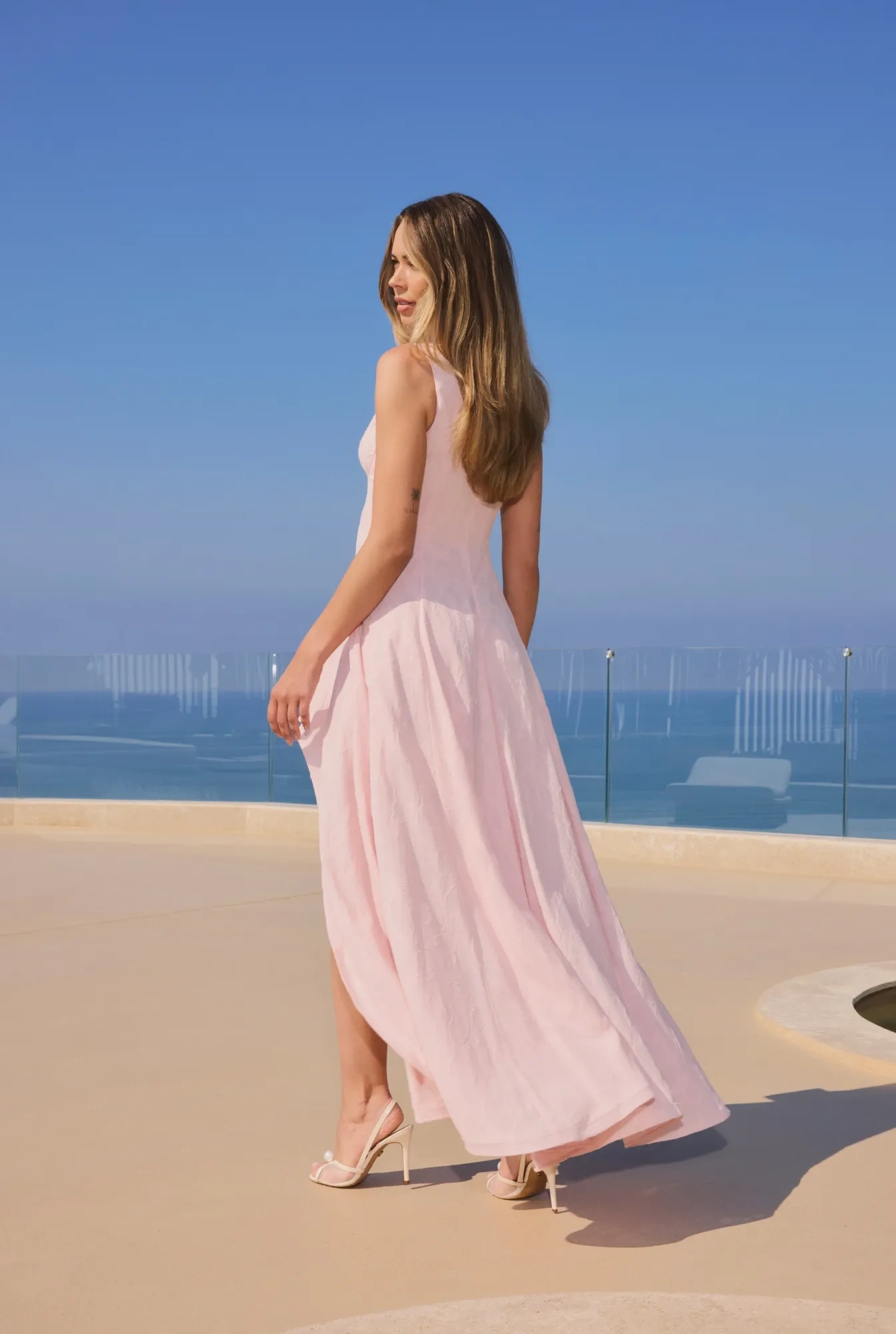 Elmina – light pink midi dress with an asymmetrical hem
